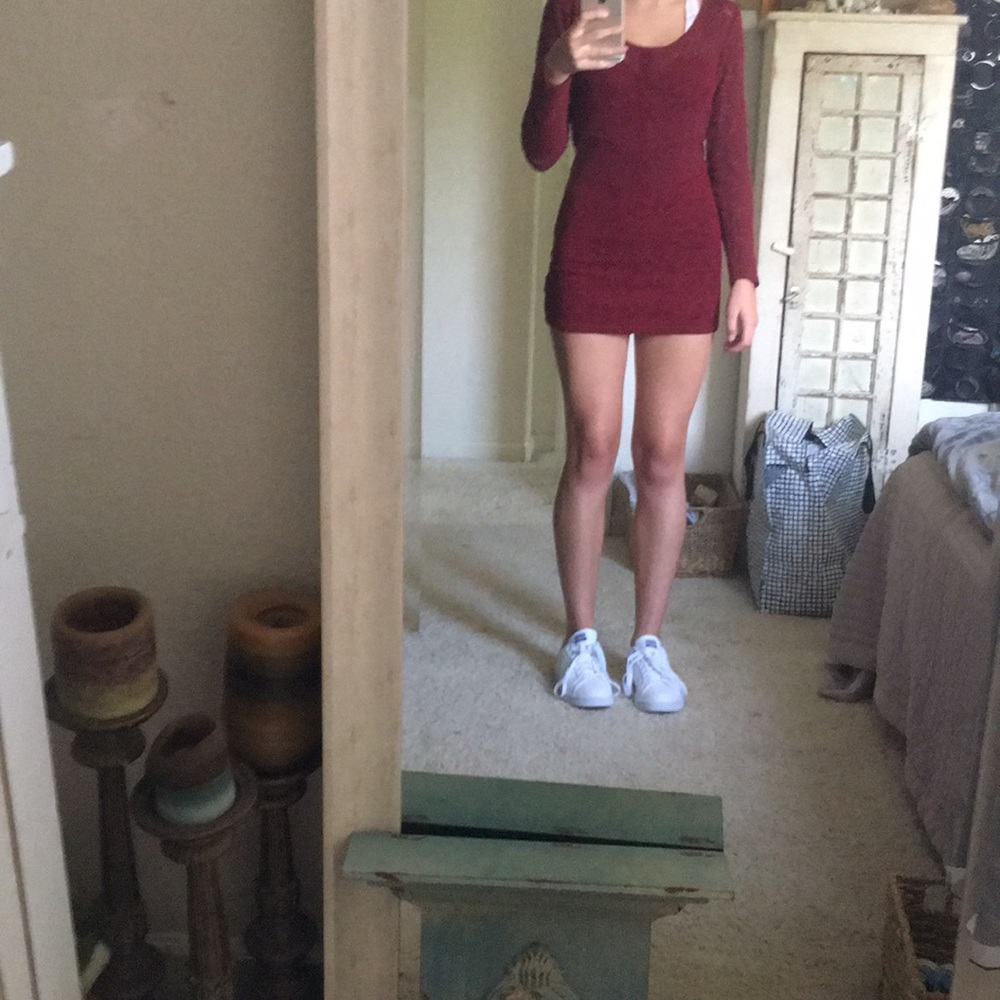 Skintight, short reddish maroon color dress